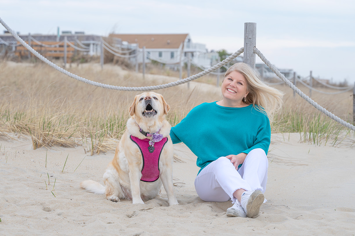 Susan Page with Dog Kiley on Beach