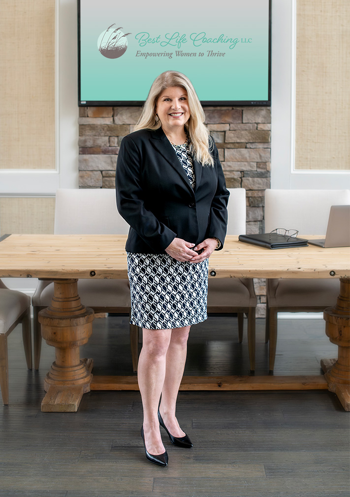 Susan Page standing in conference room